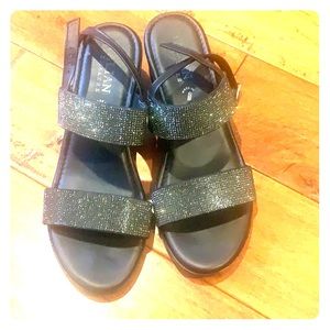 Cute shiny black wedged sandals